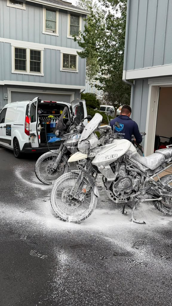 Motorcycles being foam washed on site
