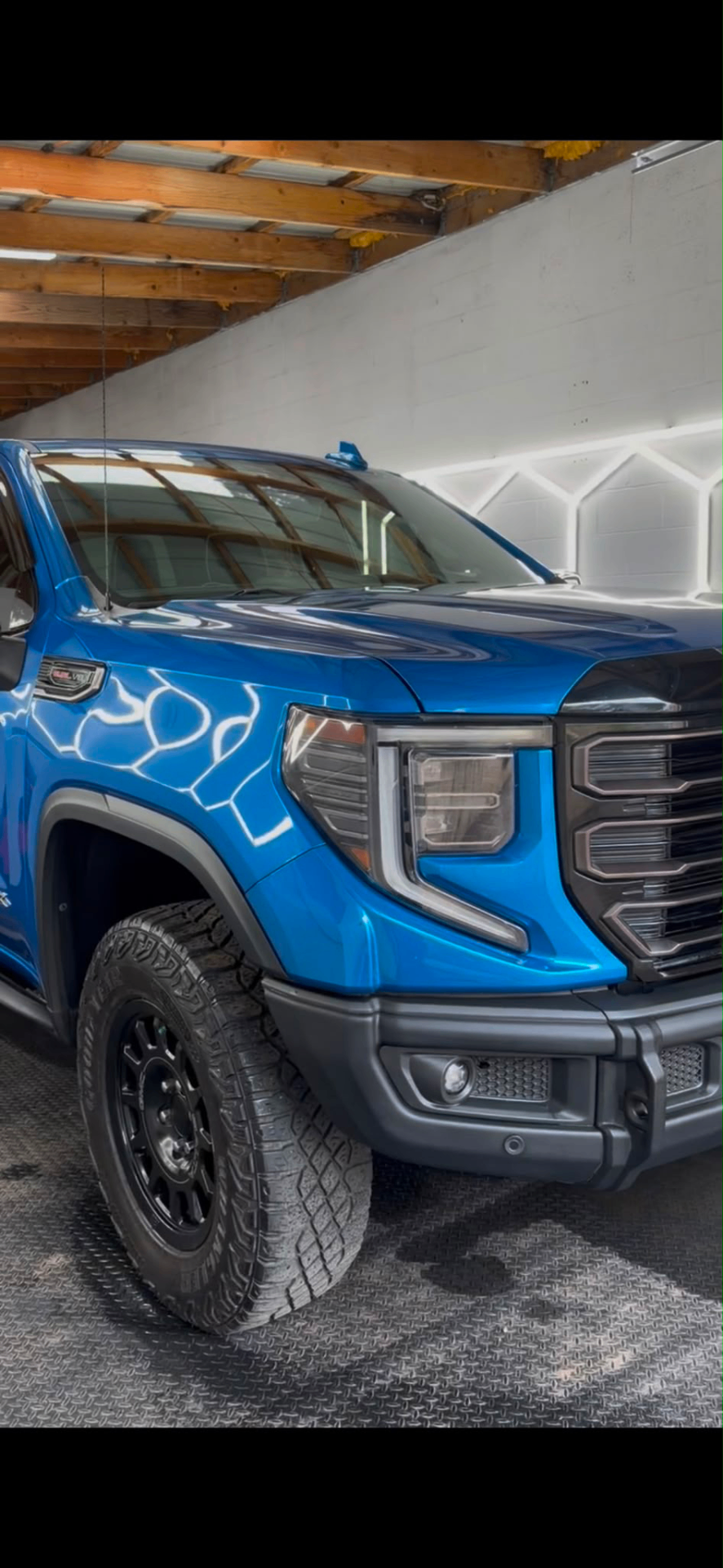 Blue GMC truck with mirror gloss finish